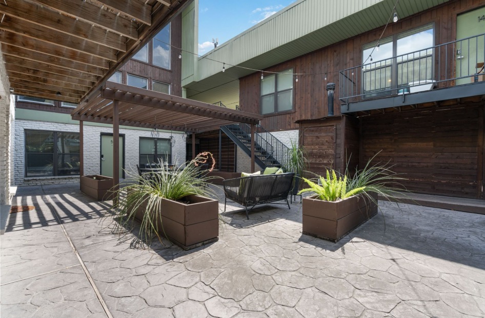 courtyard with planters and a staircase
