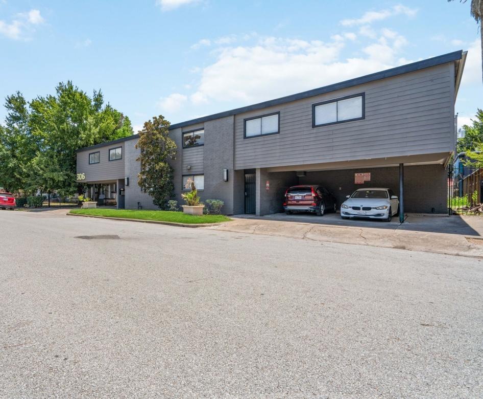 a building with cars parked in front